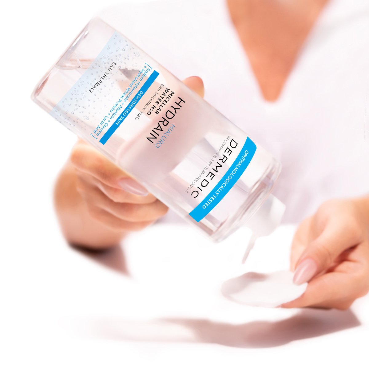 Clear plastic bottle of Dermedic HYDRAIN micellar water for rosacea-prone, sensitive skin with fragile capillaries. The label is white with blue and pink accents and includes product information in English and French.