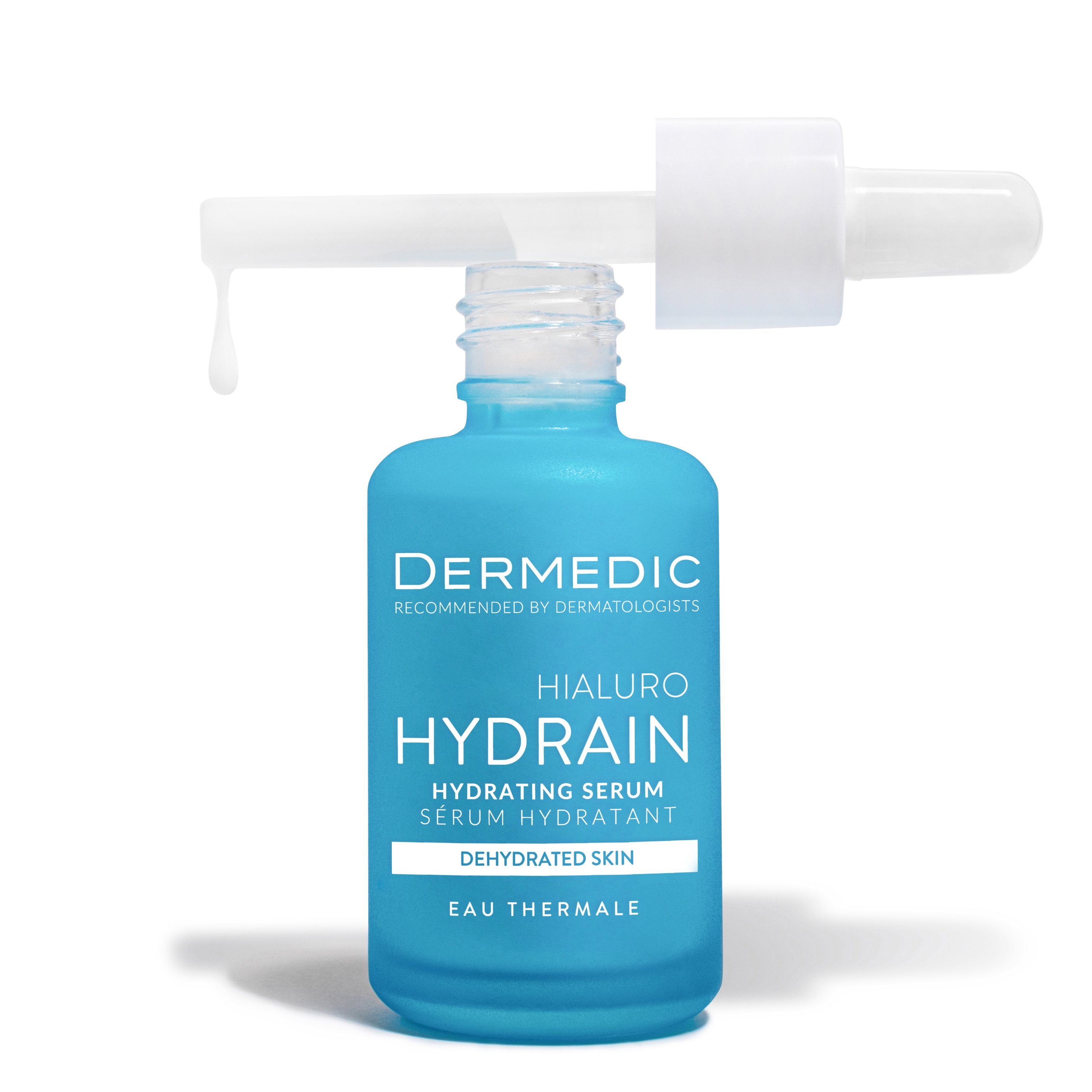 A blue bottle of Dermedic Hydrain Hydrating Serum for dehydrated skin with a dropper dispensing a drop of serum, set against a white background.