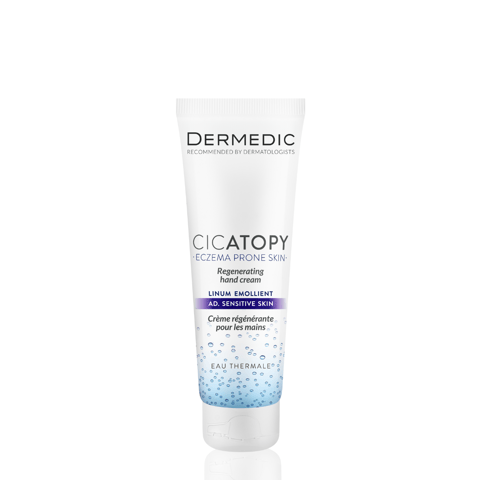 A white tube of Dermedic Cicatopy Regenerating Hand Cream for atopic-prone skin, featuring product details in blue, purple, and black text, standing upright against a plain white background.